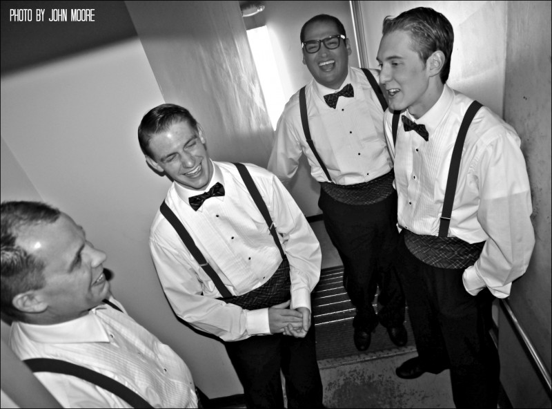 Mark Middlebrooks, Tim Howard, Barret Harper  and Jacob Villareal do vocal warmups where they find the best acoustics - in a backstage stairwell art Town Hall Arts Center. Photo by John Moore of www.CultureWest.Org. 