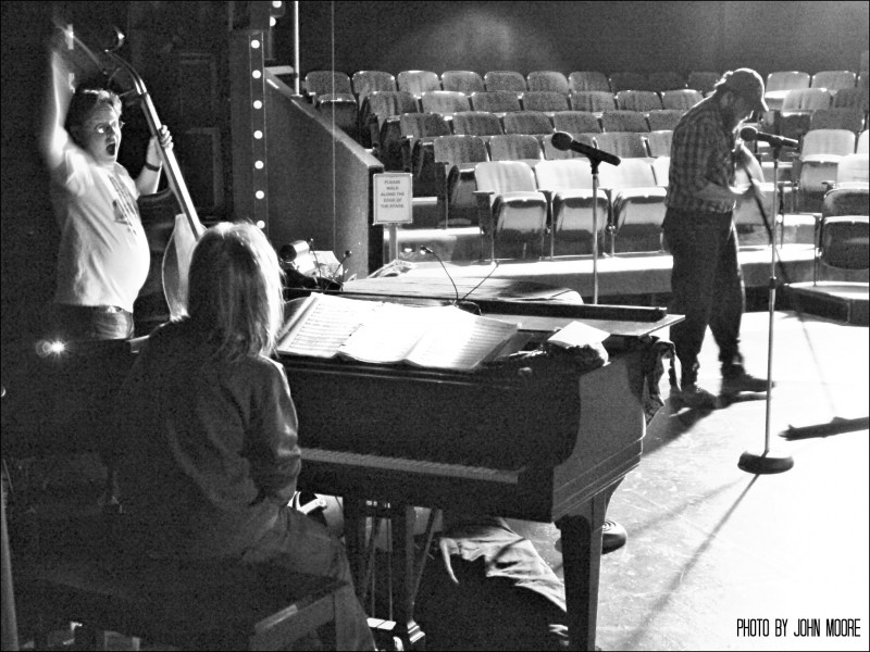 Donna Debreceni and the crew prepare to take the stage. Photo by John Moore.