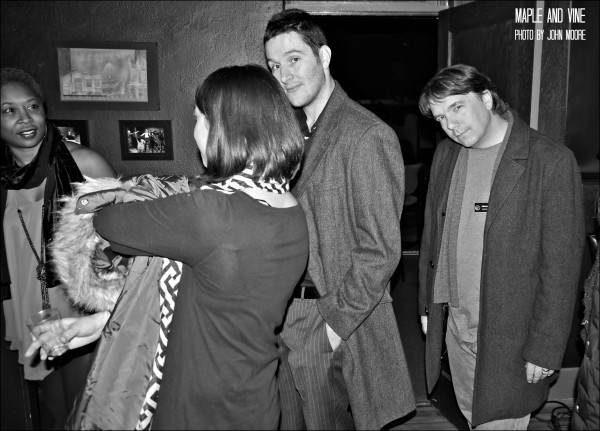 Mitch Dickman, husband of actor Karen Slack, and Curious Theatre company member Michael Morgan gather with friends in the upstairs Sanctuary Bar before the show. Photo by John Moore. 