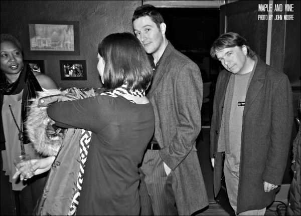 Mitch Dickman, husband of actor Karen Slack, and Curious Theatre company member Michael Morgan gather with friends in the upstairs Sanctuary Bar before the show. Photo by John Moore. 